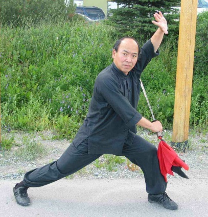 Photo of Master Wong wielding a saber